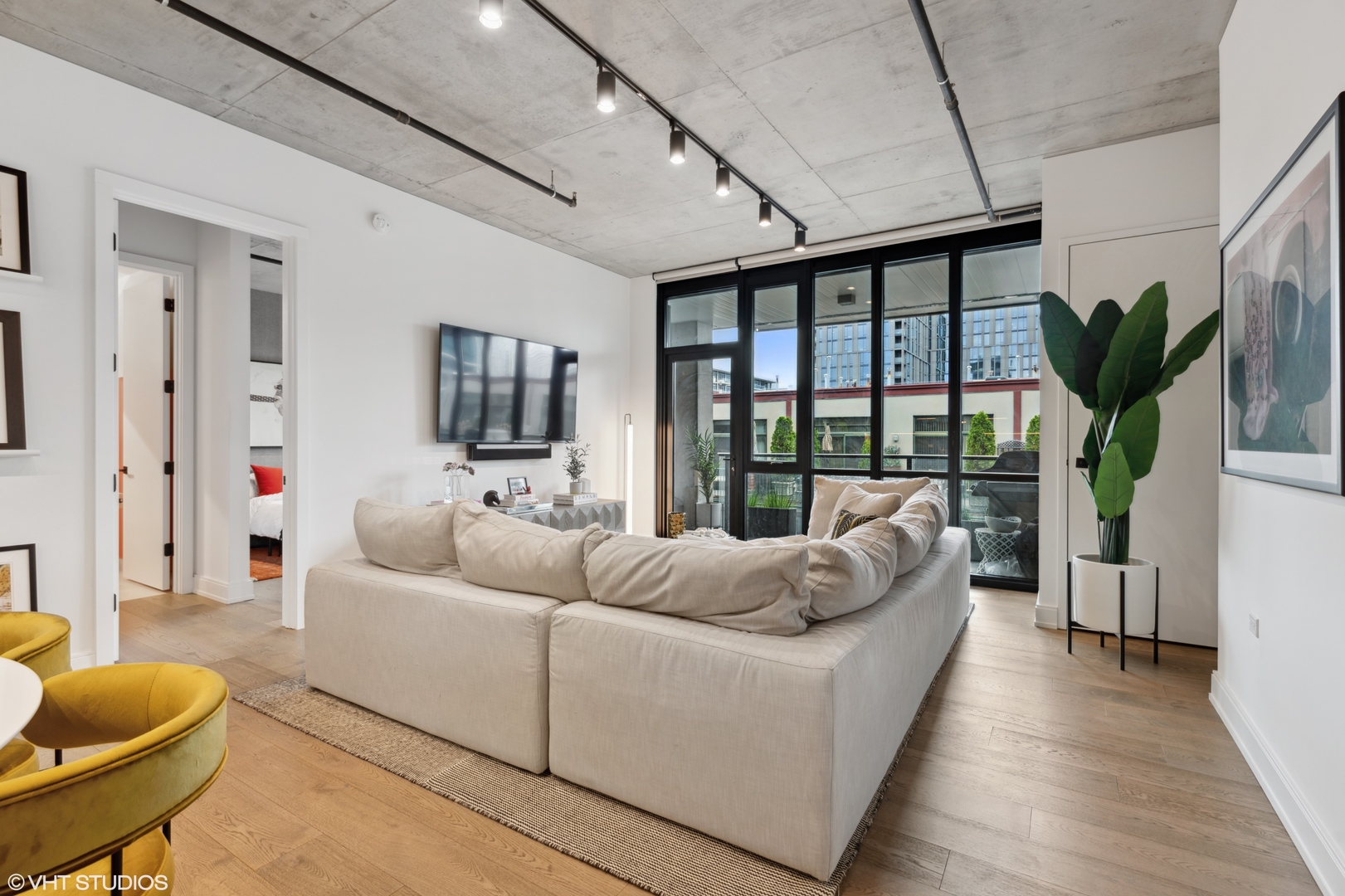 111 South Peoria Street, Unit 503 Chicago, IL 60607 - Photo 11 of 29 a living room with furniture and a large window