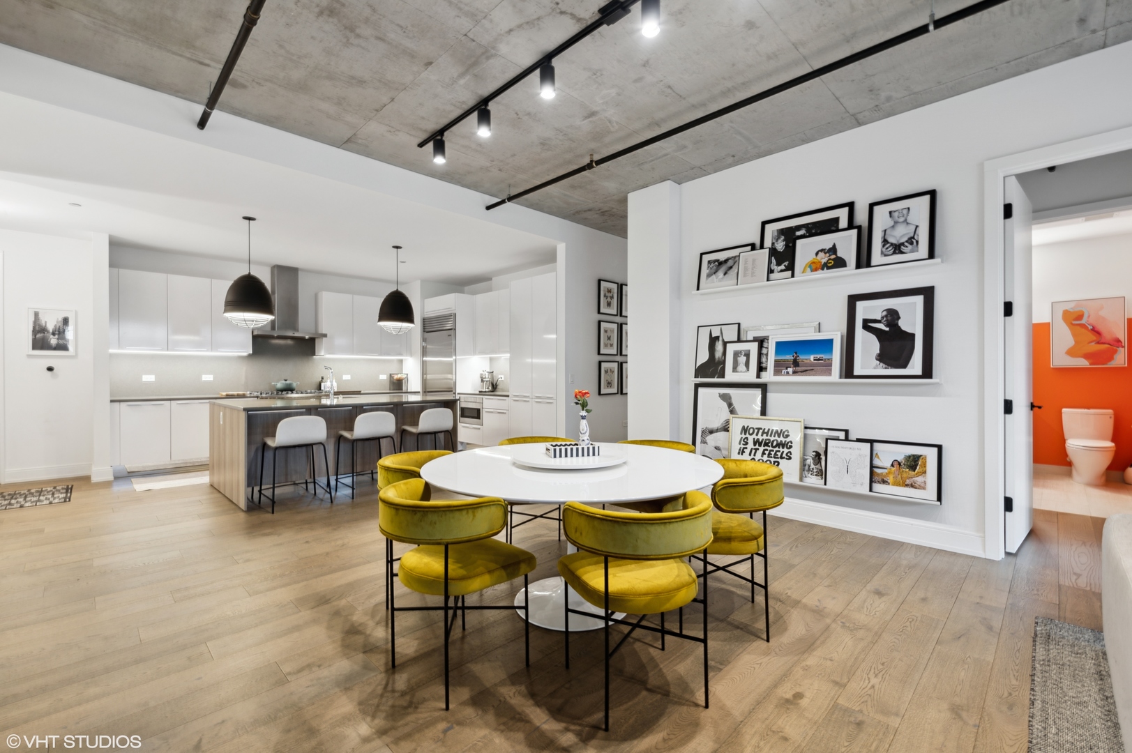 111 South Peoria Street, Unit 503 Chicago, IL 60607 - Photo 12 of 29 a view of a dining room with furniture and wooden floor