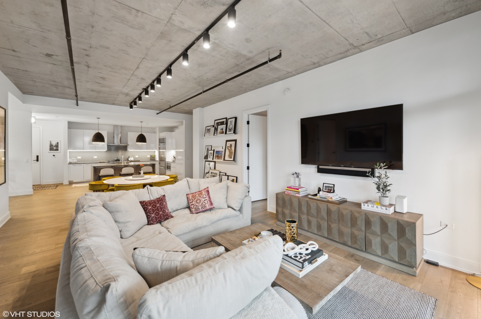 111 South Peoria Street, Unit 503 Chicago, IL 60607 - Photo 14 of 29 a living room with furniture and a flat screen tv