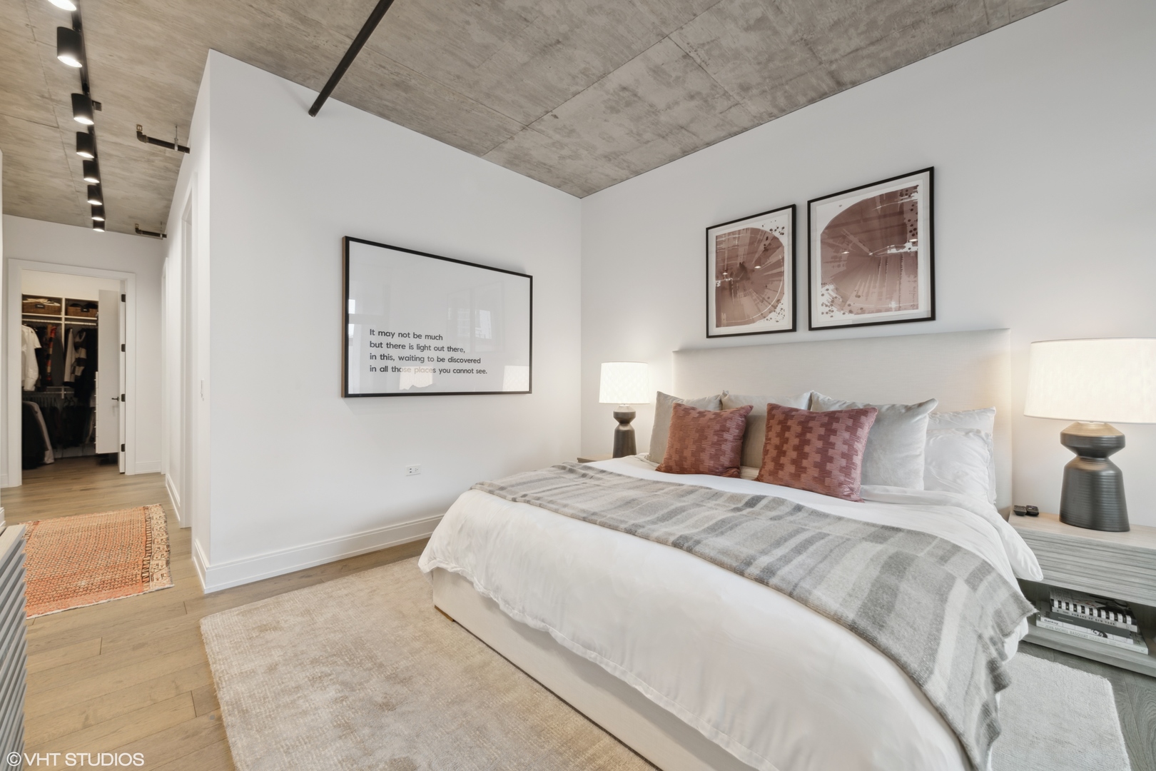 111 South Peoria Street, Unit 503 Chicago, IL 60607 - Photo 16 of 29 a bedroom with a bed and a painting on the wall