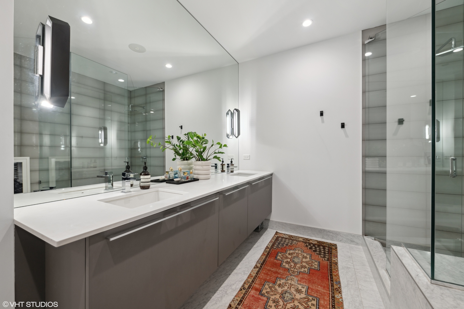 111 South Peoria Street, Unit 503 Chicago, IL 60607 - Photo 17 of 29 a bathroom with a sink and a mirror