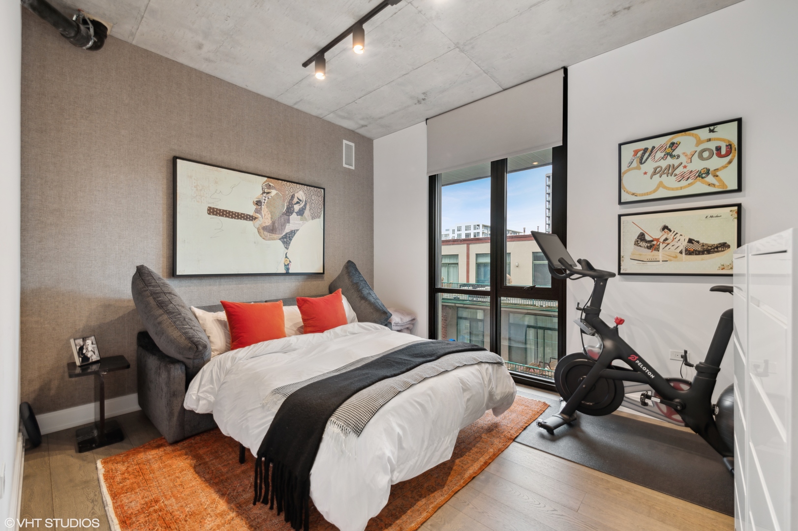 111 South Peoria Street, Unit 503 Chicago, IL 60607 - Photo 24 of 29 a bedroom with bed and a flat screen tv