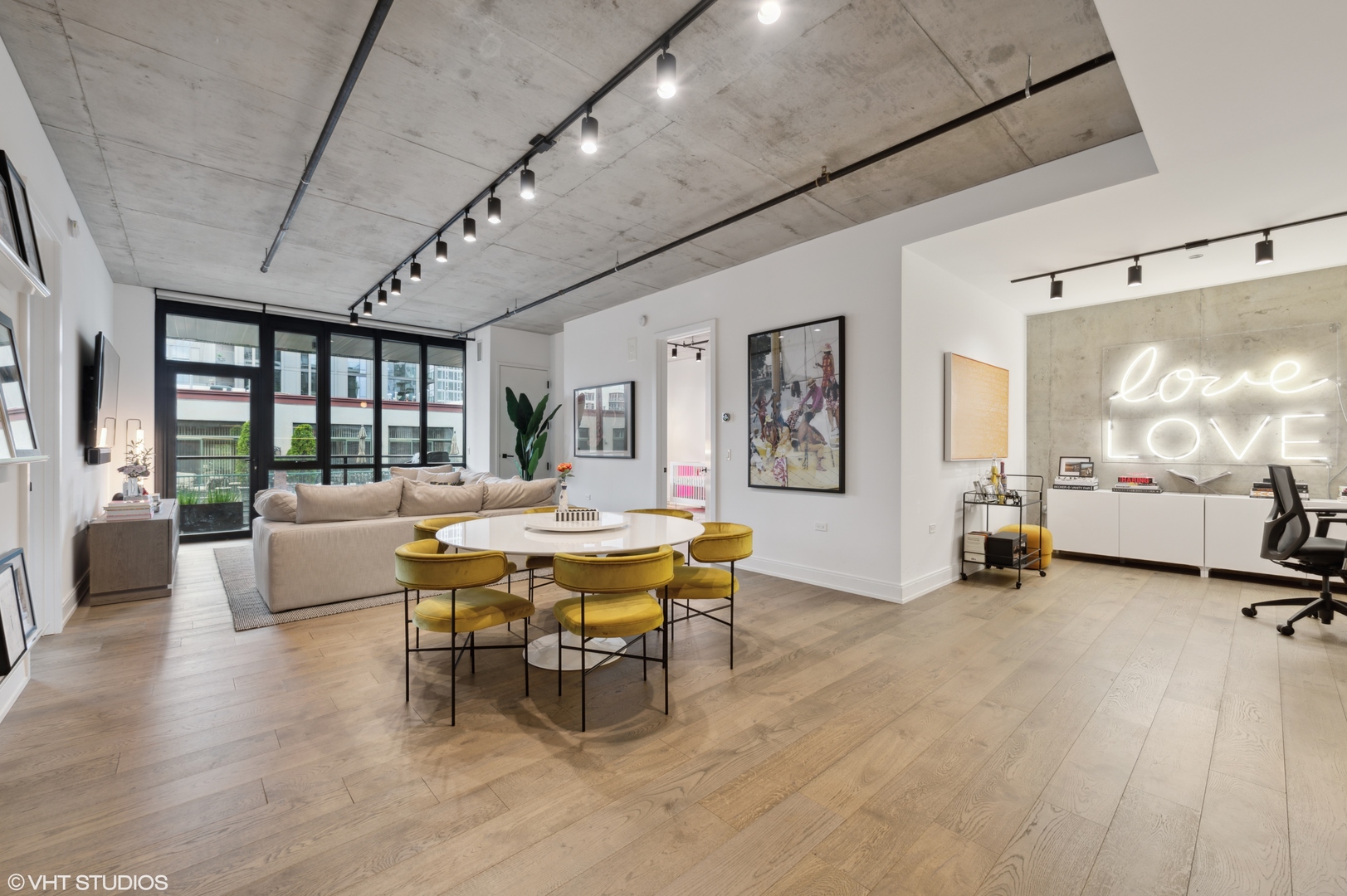 111 South Peoria Street, Unit 503 Chicago, IL 60607 - Photo 9 of 29 a dining room with wooden floor and furniture