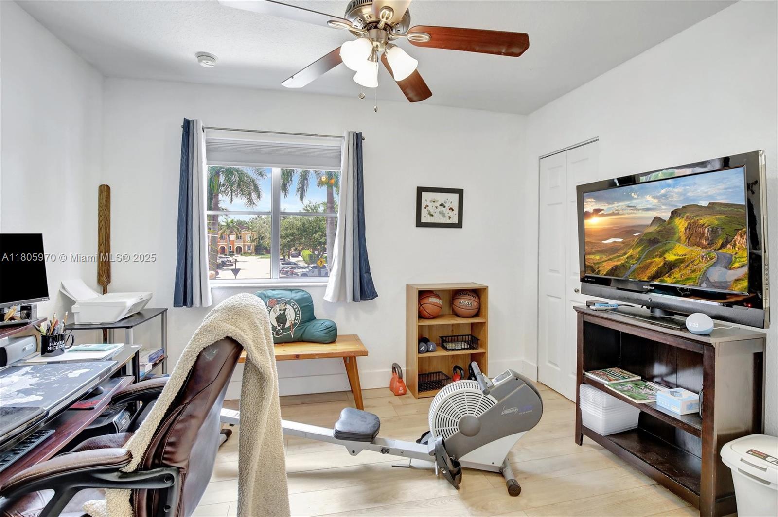 8999 Southwest 18th Street, Unit 1401 Miramar, FL 33025 - Photo 14 of 51 a living room with furniture a window and a flat screen tv
