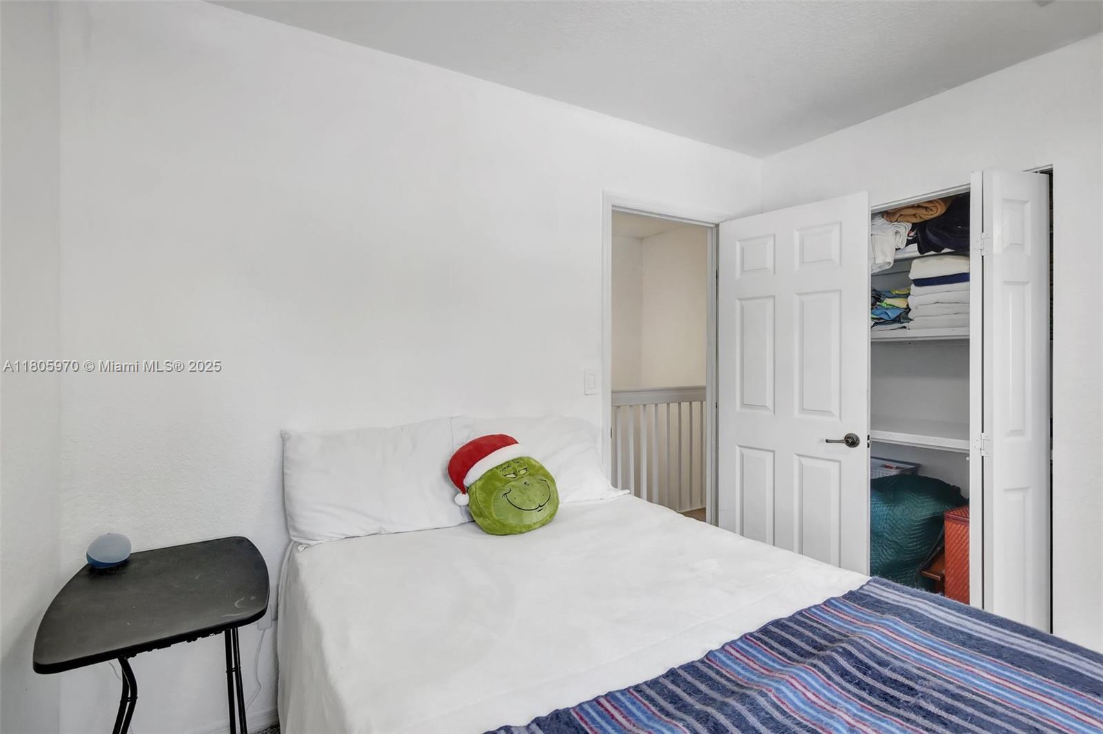 8999 Southwest 18th Street, Unit 1401 Miramar, FL 33025 - Photo 18 of 51 a view of a room with wooden floor and closet