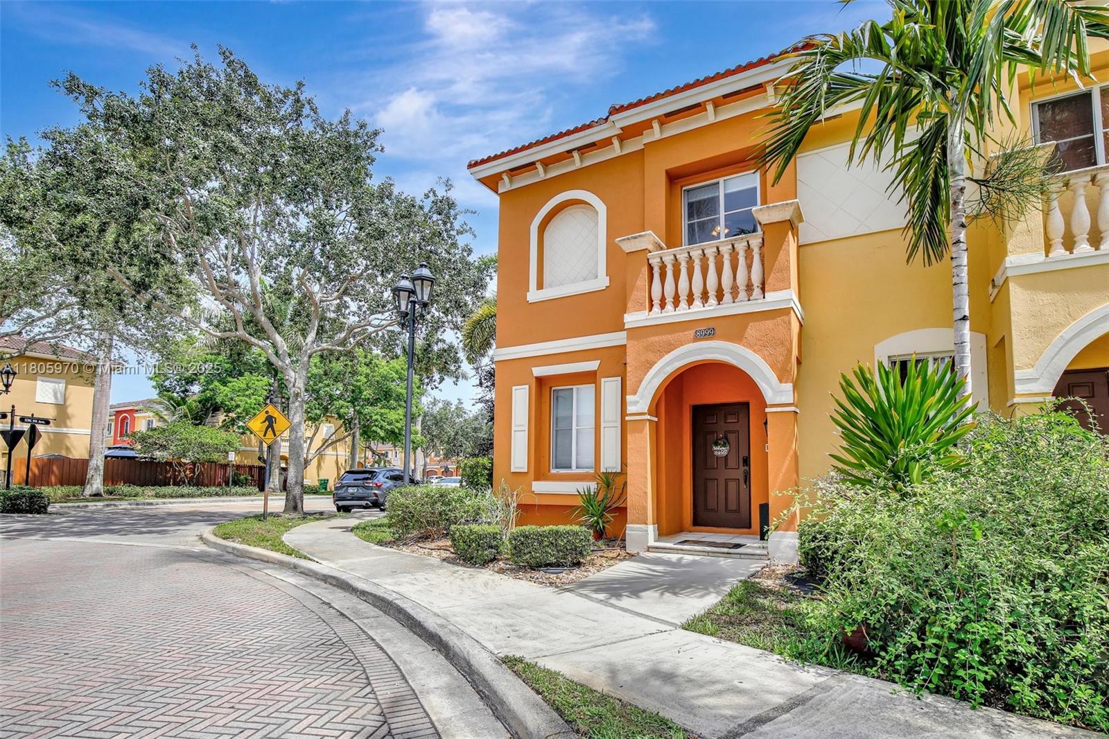 8999 Southwest 18th Street, Unit 1401 Miramar, FL 33025 - Photo 2 of 51 a front view of a house with a yard