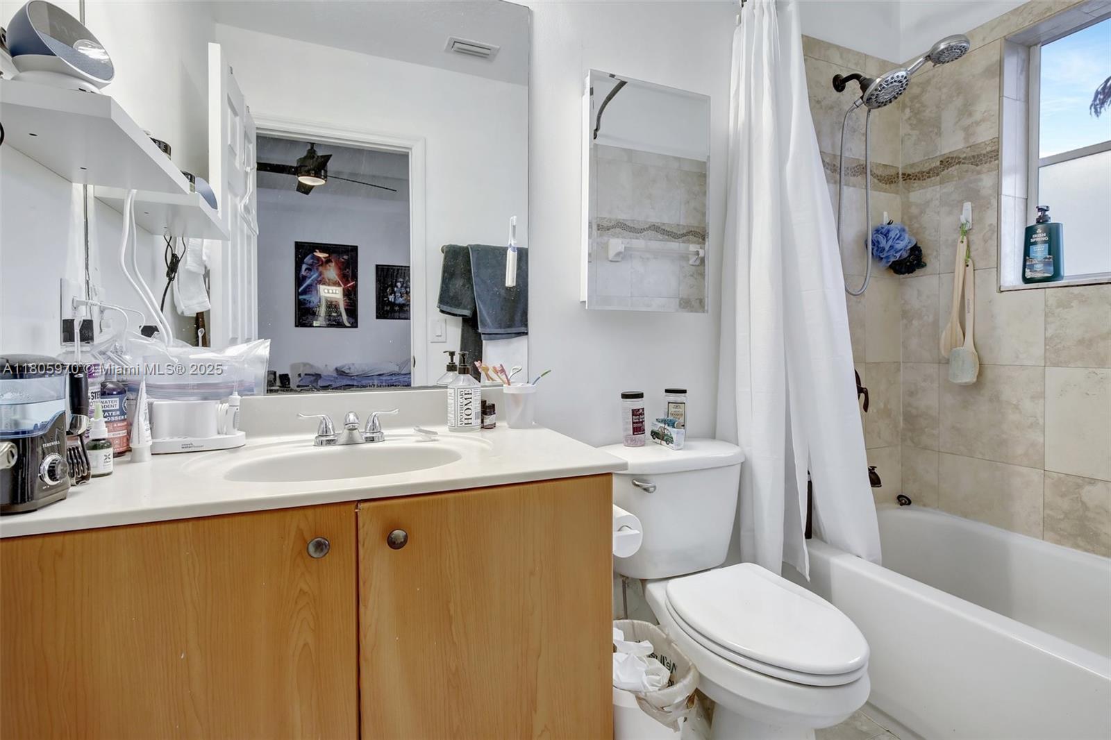 8999 Southwest 18th Street, Unit 1401 Miramar, FL 33025 - Photo 22 of 51 a bathroom with a sink toilet and shower