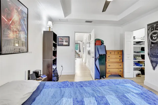 a bed room with a bed and a walk in closet