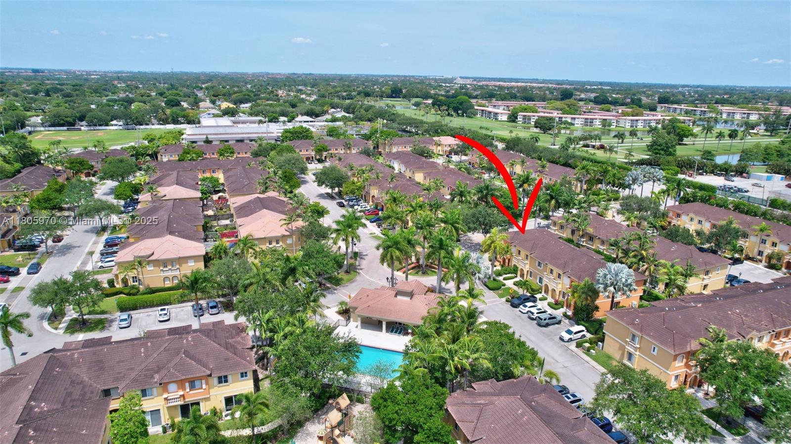 8999 Southwest 18th Street, Unit 1401 Miramar, FL 33025 - Photo 26 of 51 an aerial view of residential houses with outdoor space and trees