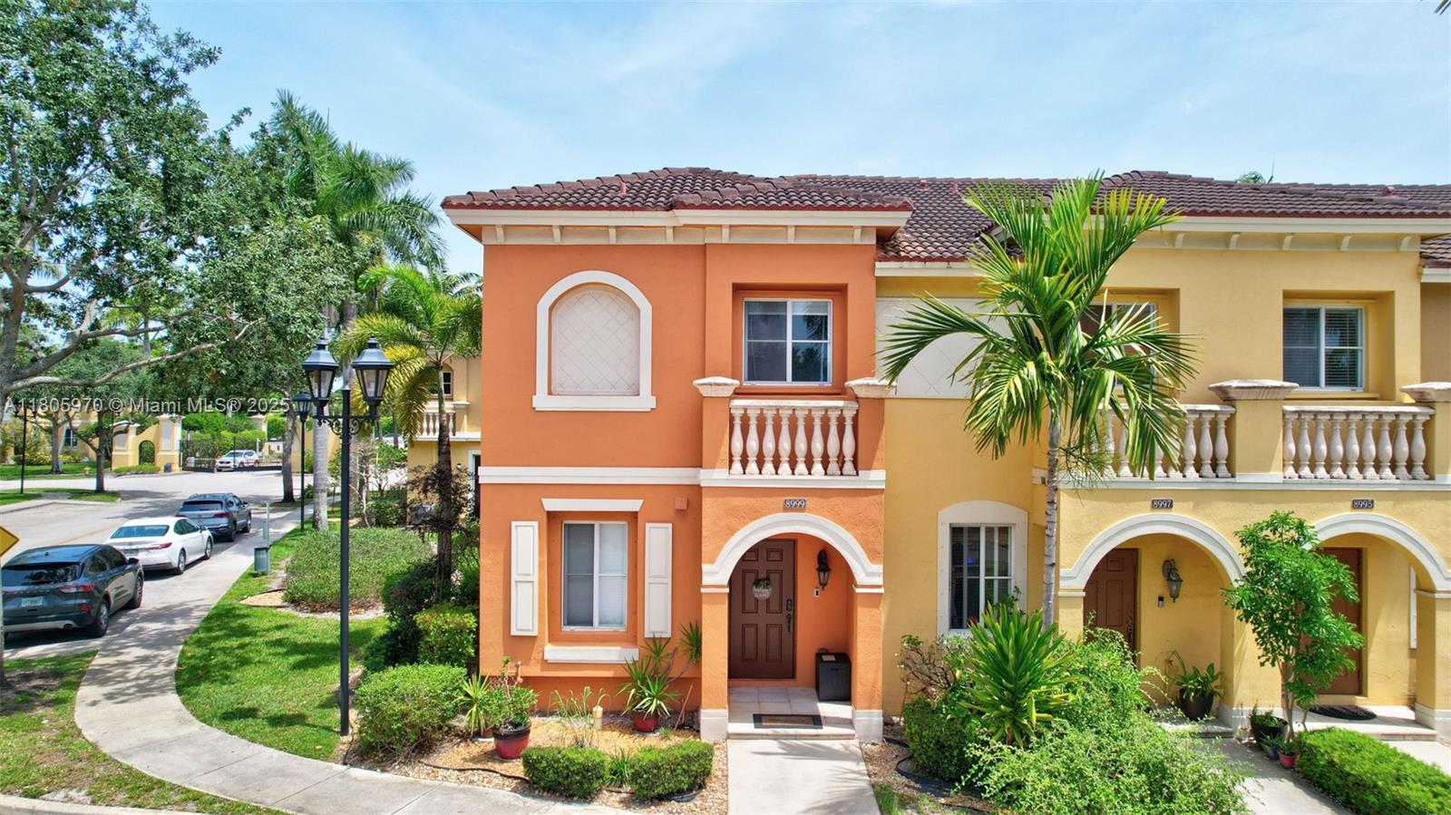 8999 Southwest 18th Street, Unit 1401 Miramar, FL 33025 - Photo 3 of 51 a front view of a house with a yard