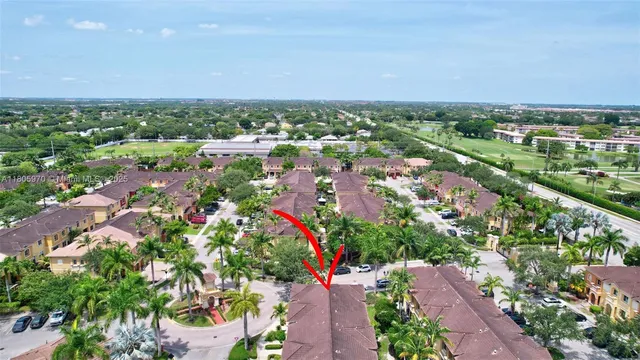 a living room with furniture a chandelier and a dining table