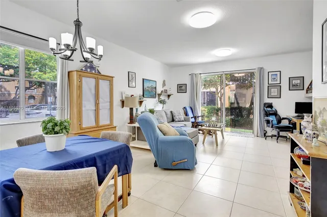 a workspace with furniture and a floor to ceiling window