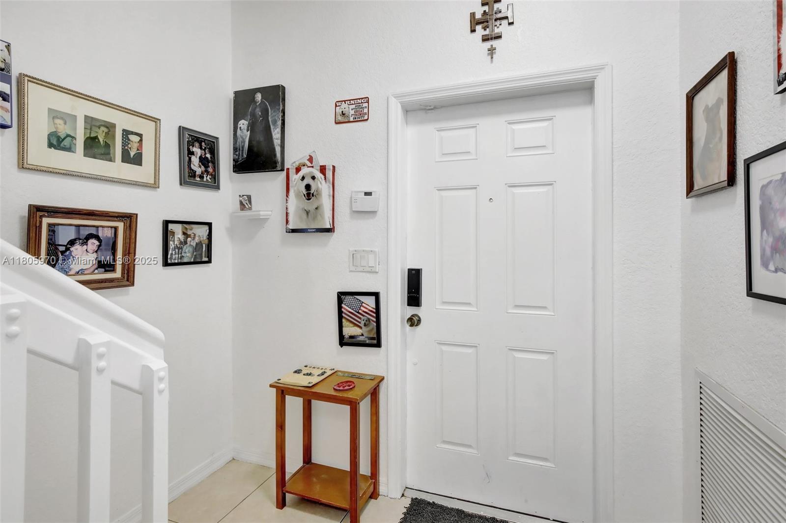 8999 Southwest 18th Street, Unit 1401 Miramar, FL 33025 - Photo 47 of 51 a hallway with table and couch