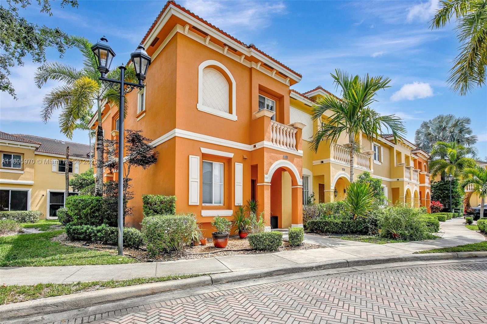 8999 Southwest 18th Street, Unit 1401 Miramar, FL 33025 - Photo 5 of 51 a view of a white house with a outdoor space