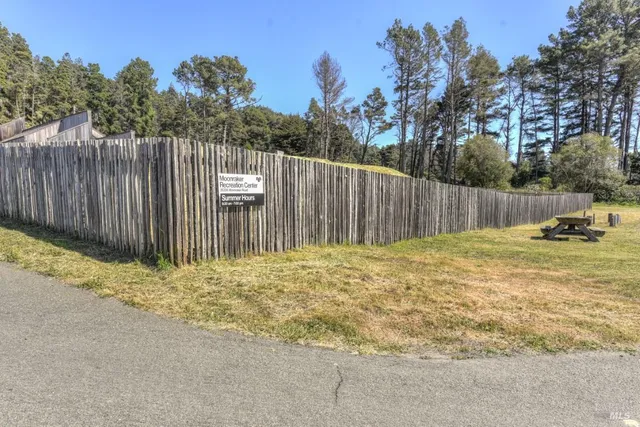 a fire hydrant in the middle of a field