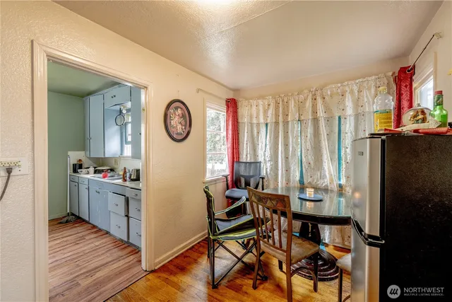 a view of a dining room with furniture and a window