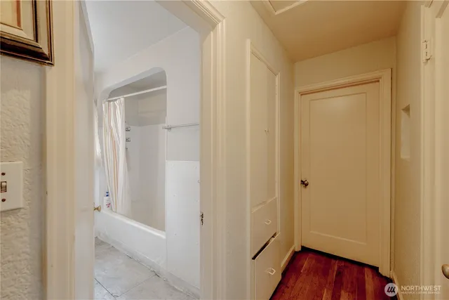 a bathroom with a shower toilet and sink