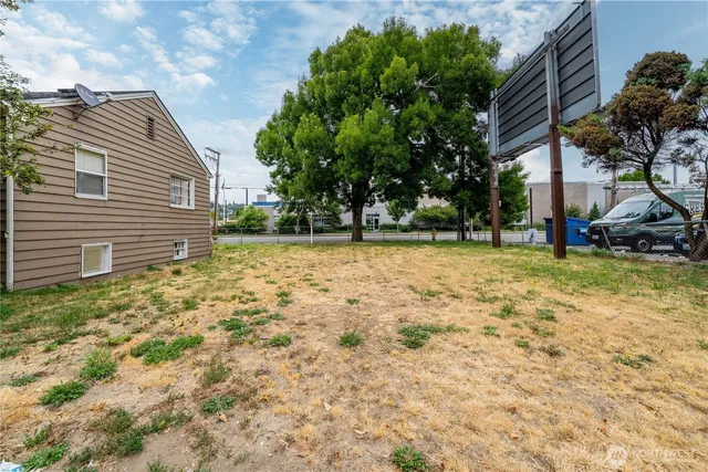 a backyard of a house with lots of green space