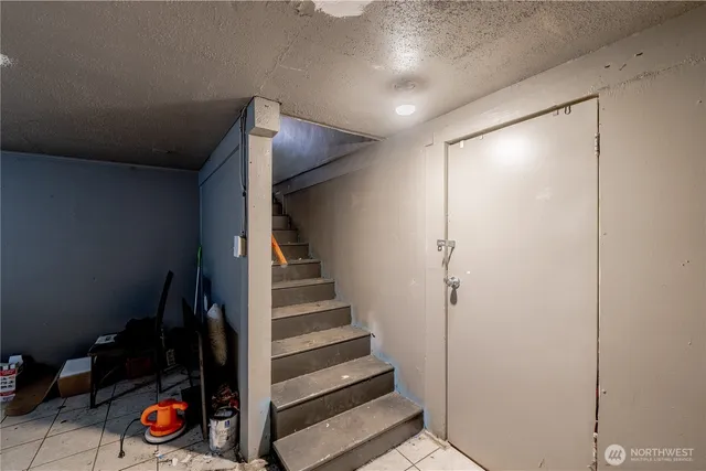 a view of a house with a door and wooden walls