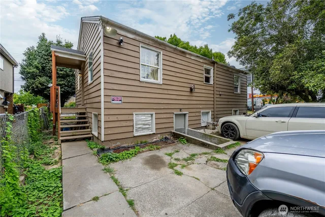 a view of a cars parked on the side of a street