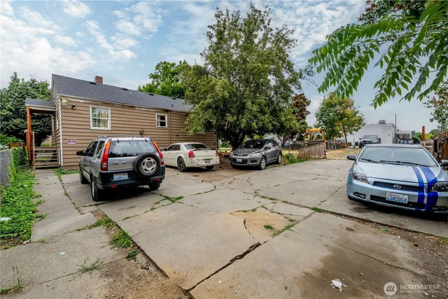 a view of street with parked cars