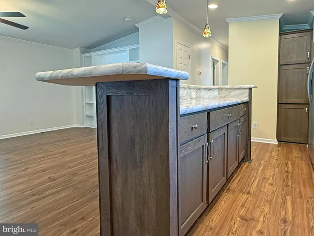 a kitchen with stainless steel appliances granite countertop a stove and a microwave