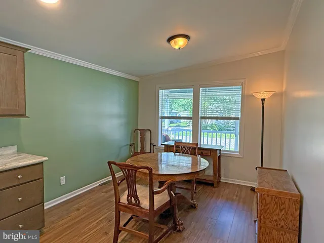a open kitchen with sink and a large window