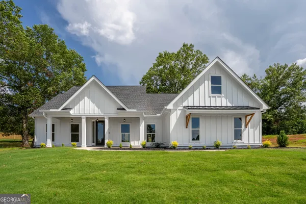 front view of a house with a garden