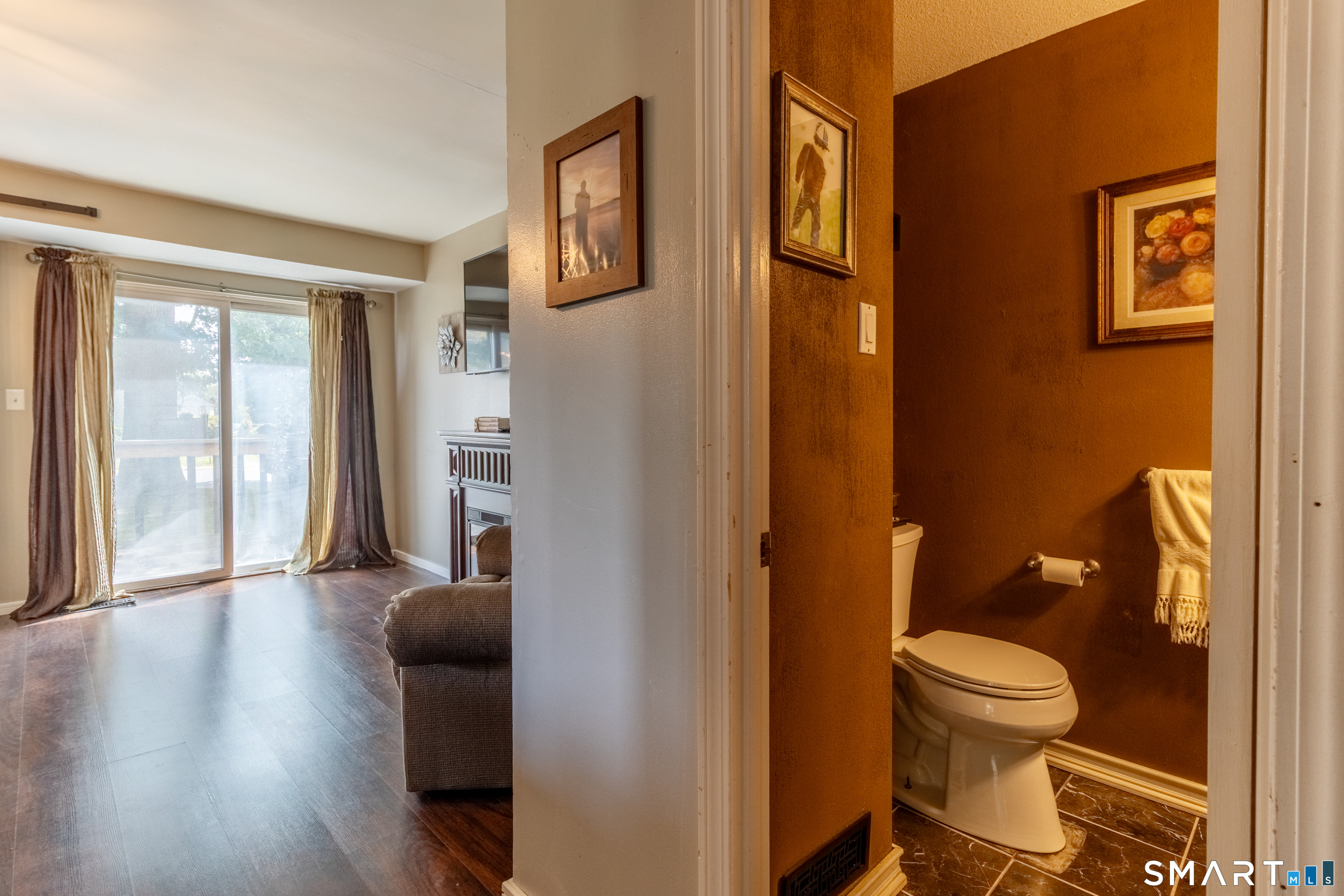 94 Cottonwood Road, Unit 94 Newington, CT 06111 - Photo 13 of 33 Half Bathroom in between Living Room and Kitchen with access door to Basement.