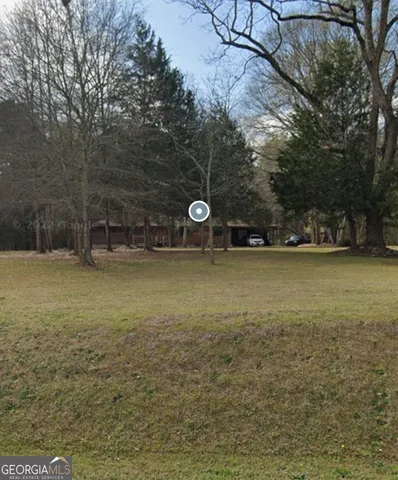 a view of a yard with a trees
