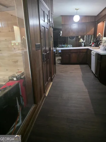 a kitchen with stainless steel appliances granite countertop a refrigerator