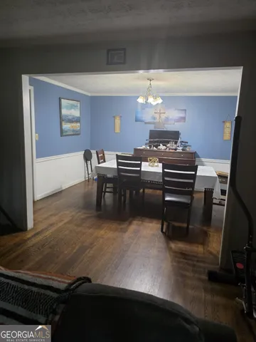 a room with furniture and a chandelier