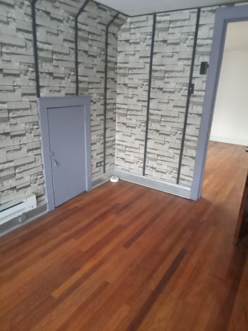 8446 South May Street Chicago, IL 60620 - Photo 5 of 6 a view of empty room with wooden floor