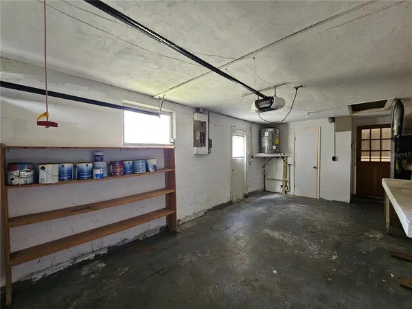 a view of a room with lots of wooden furniture and windows
