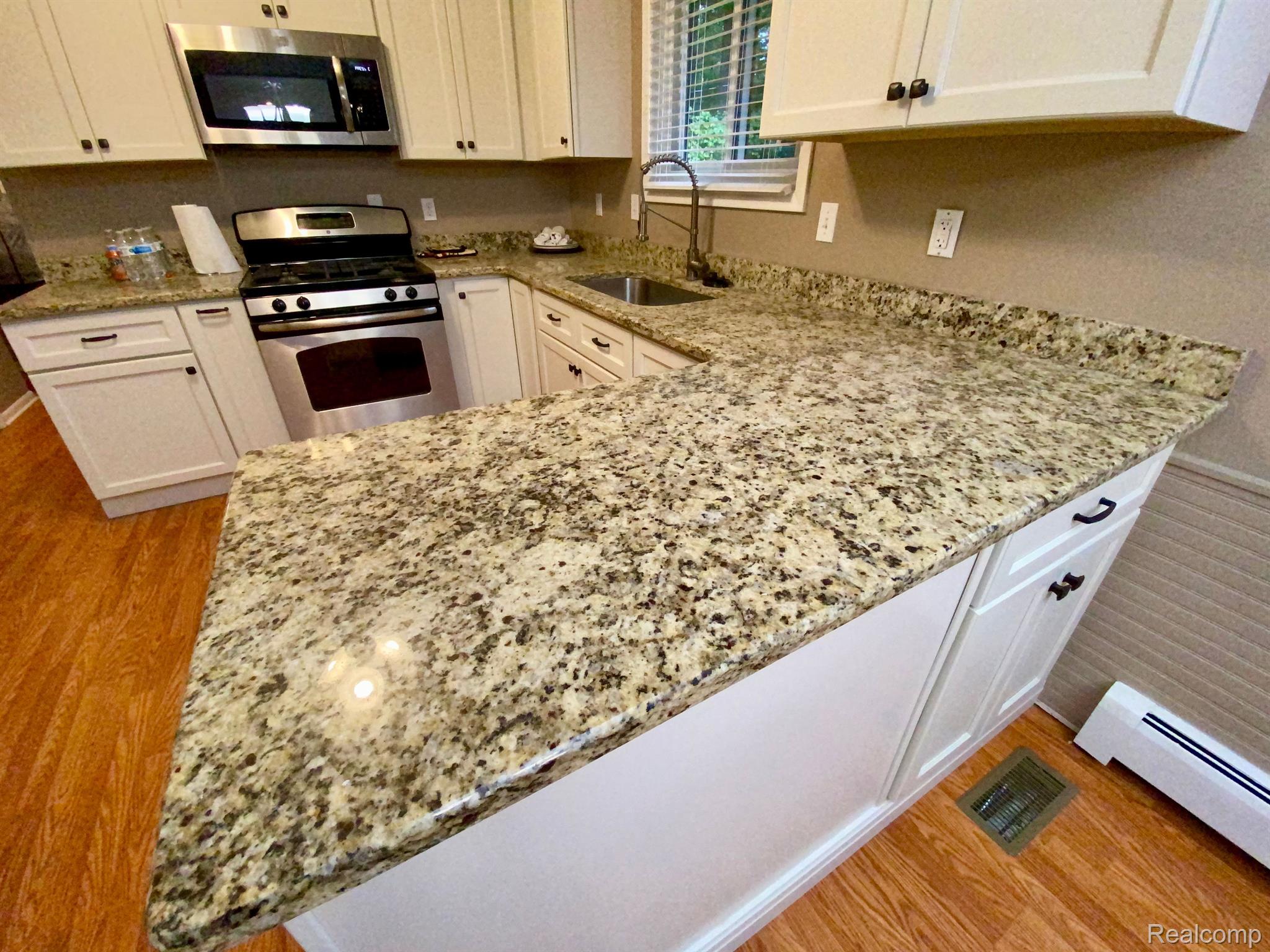 8388 32 Mile Road Washington, MI 48095 - Photo 9 of 18 Kitchen with New Cabinets & Granite Tops