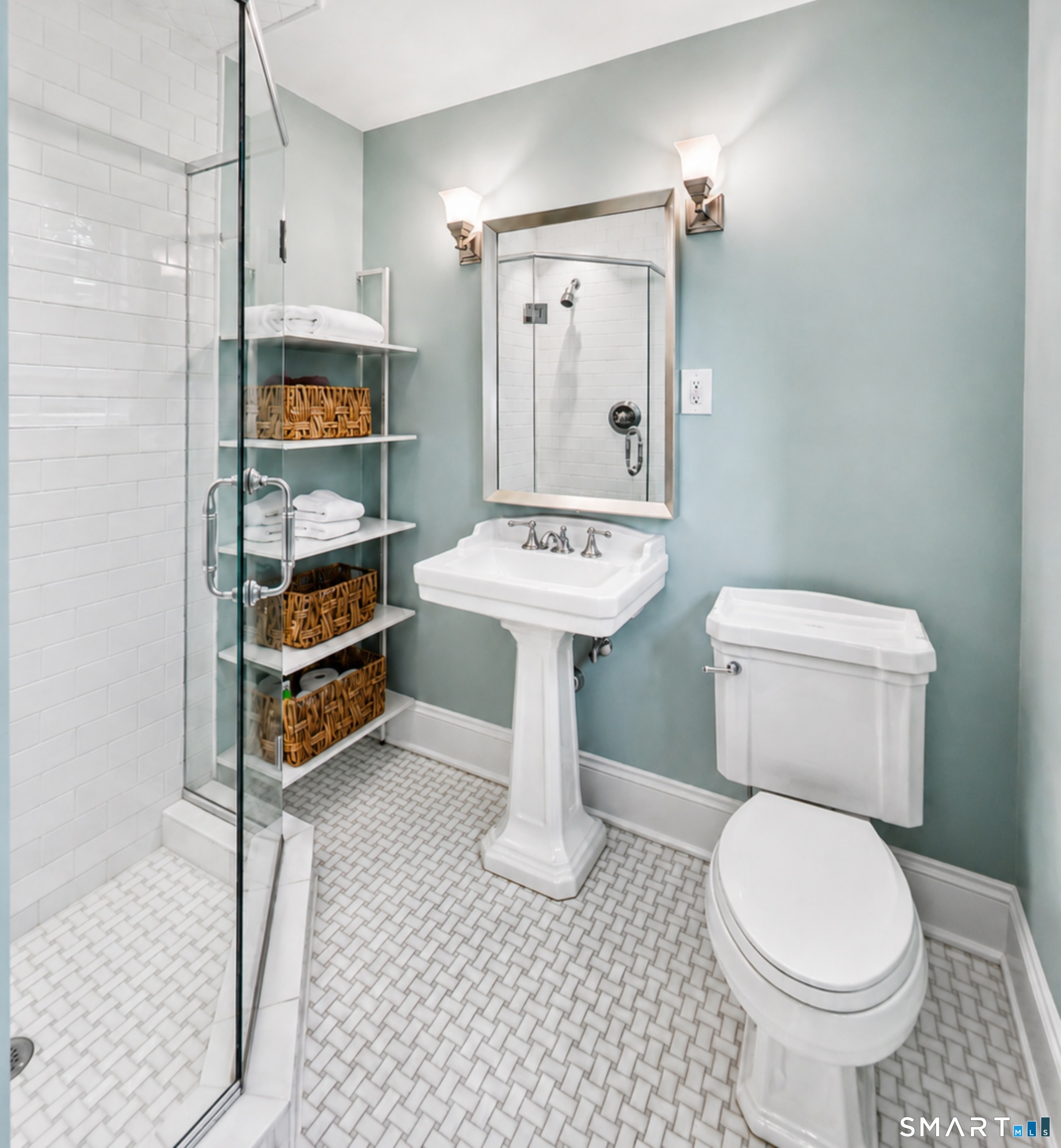 99 Hickok Road New Canaan, CT 06840 - Photo 27 of 39 a bathroom with a sink a toilet and a mirror