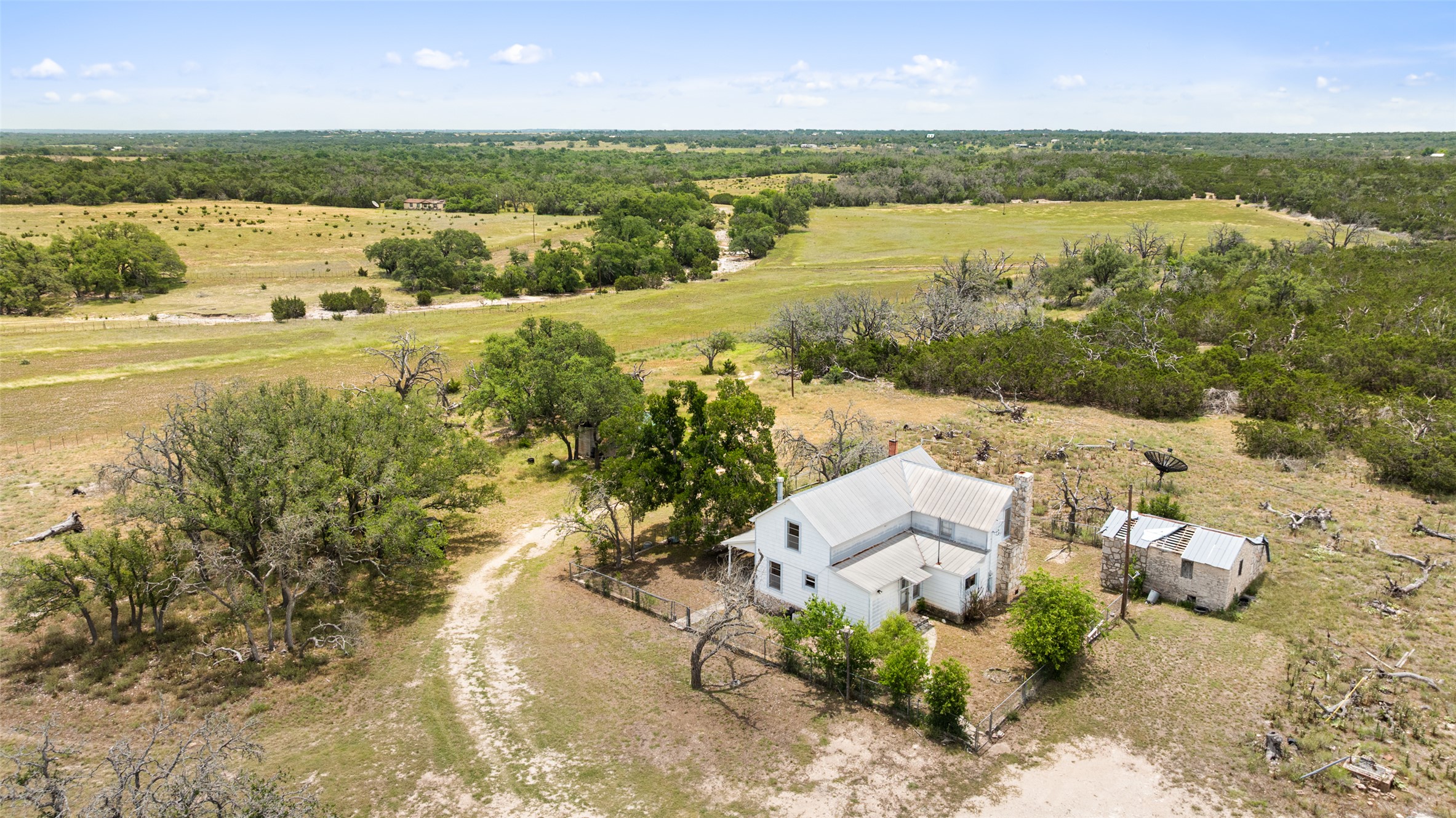 65 Miles Lane Harper, TX 78631 - Photo 16 of 27 an aerial view of residential houses with outdoor space