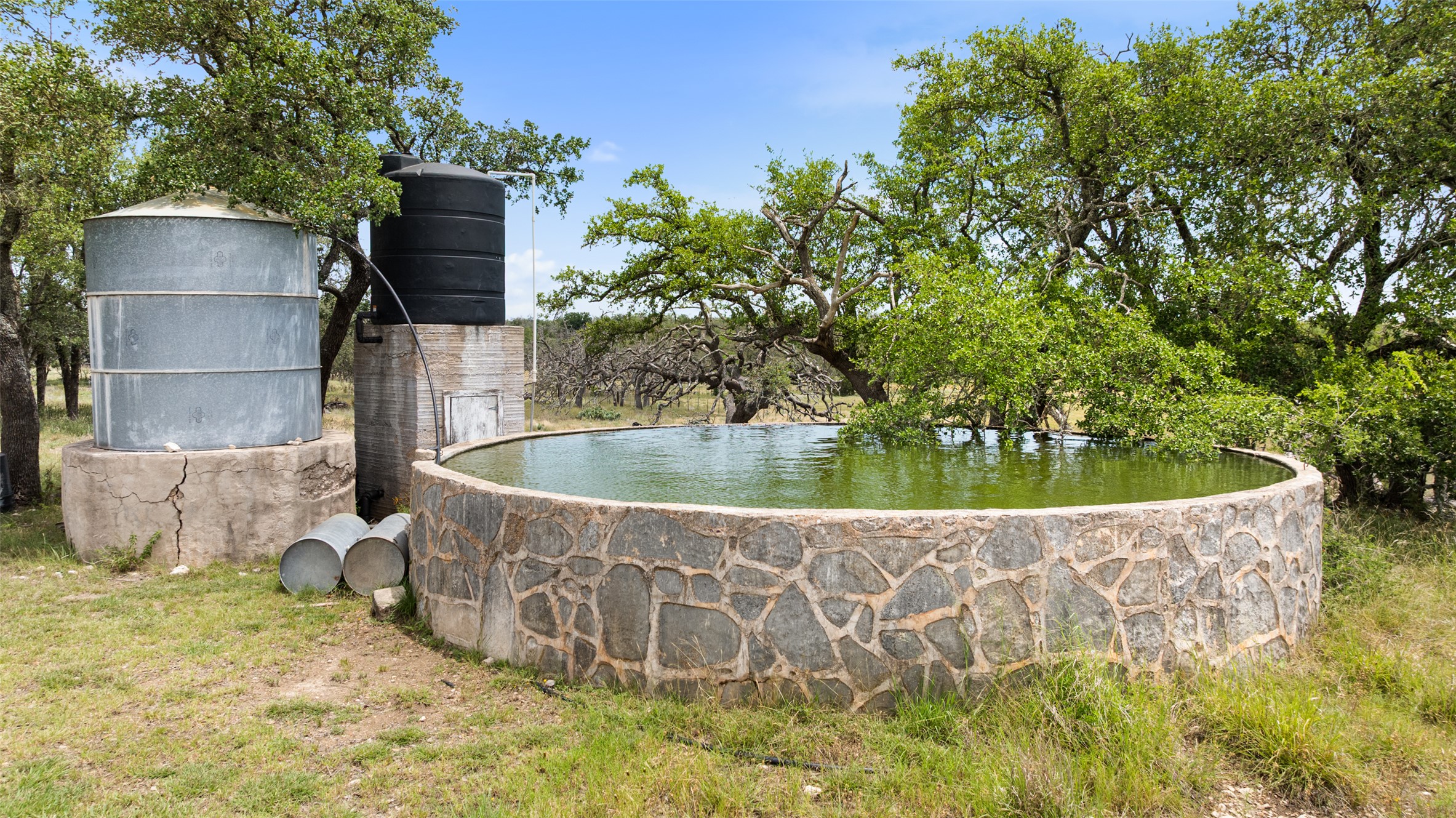 65 Miles Lane Harper, TX 78631 - Photo 23 of 27 a front view of a house with a garden
