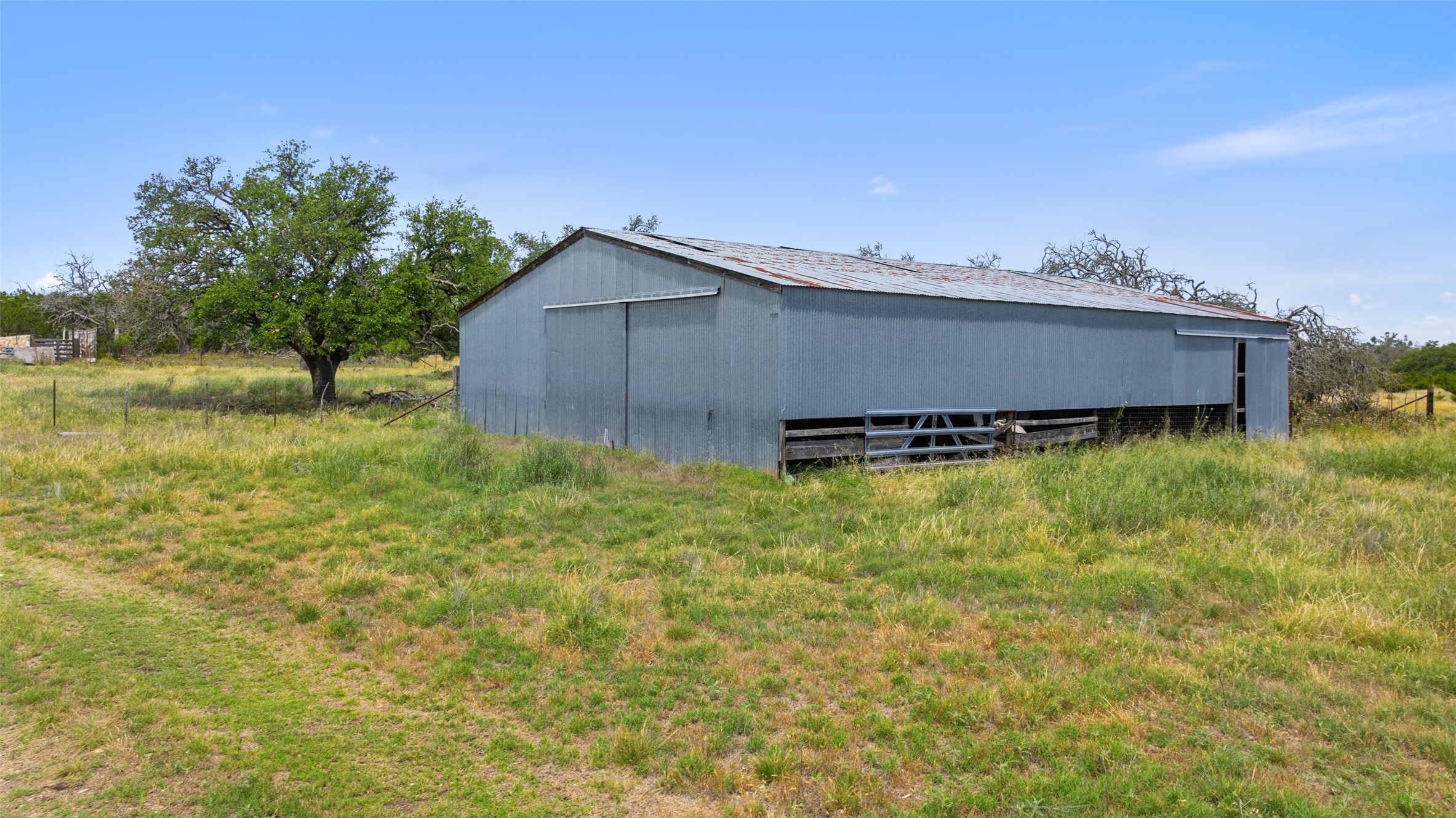 65 Miles Lane Harper, TX 78631 - Photo 7 of 27 a backyard of a house with lots of green space