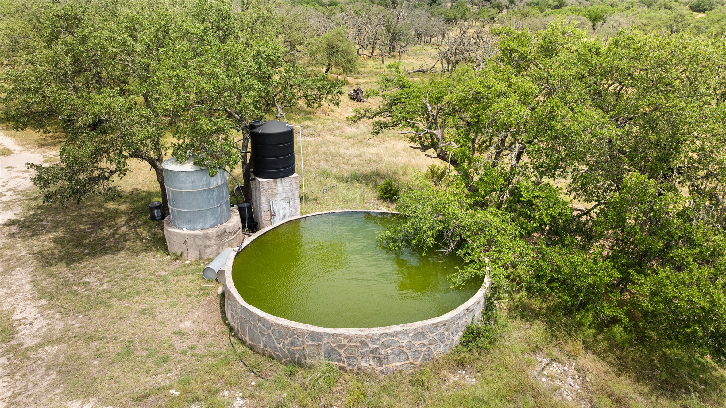 65 Miles Lane Harper, TX 78631 - Photo 9 of 27 a view of a fountain in the backyard