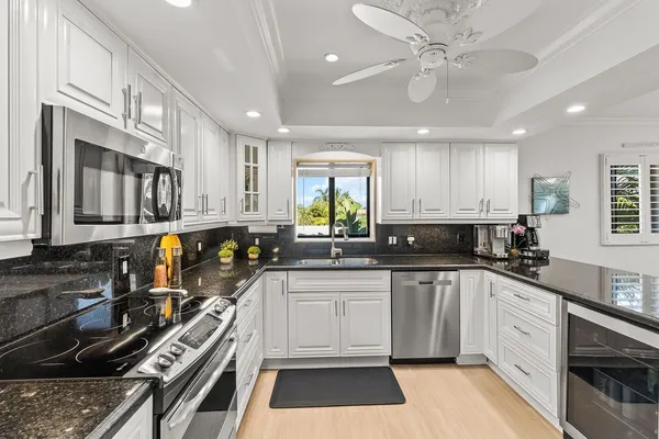 a bedroom with bed and flat screen tv