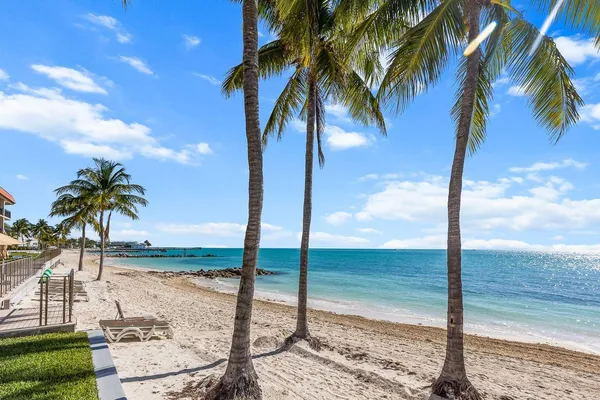 a kitchen with stainless steel appliances granite countertop a stove sink microwave and cabinets