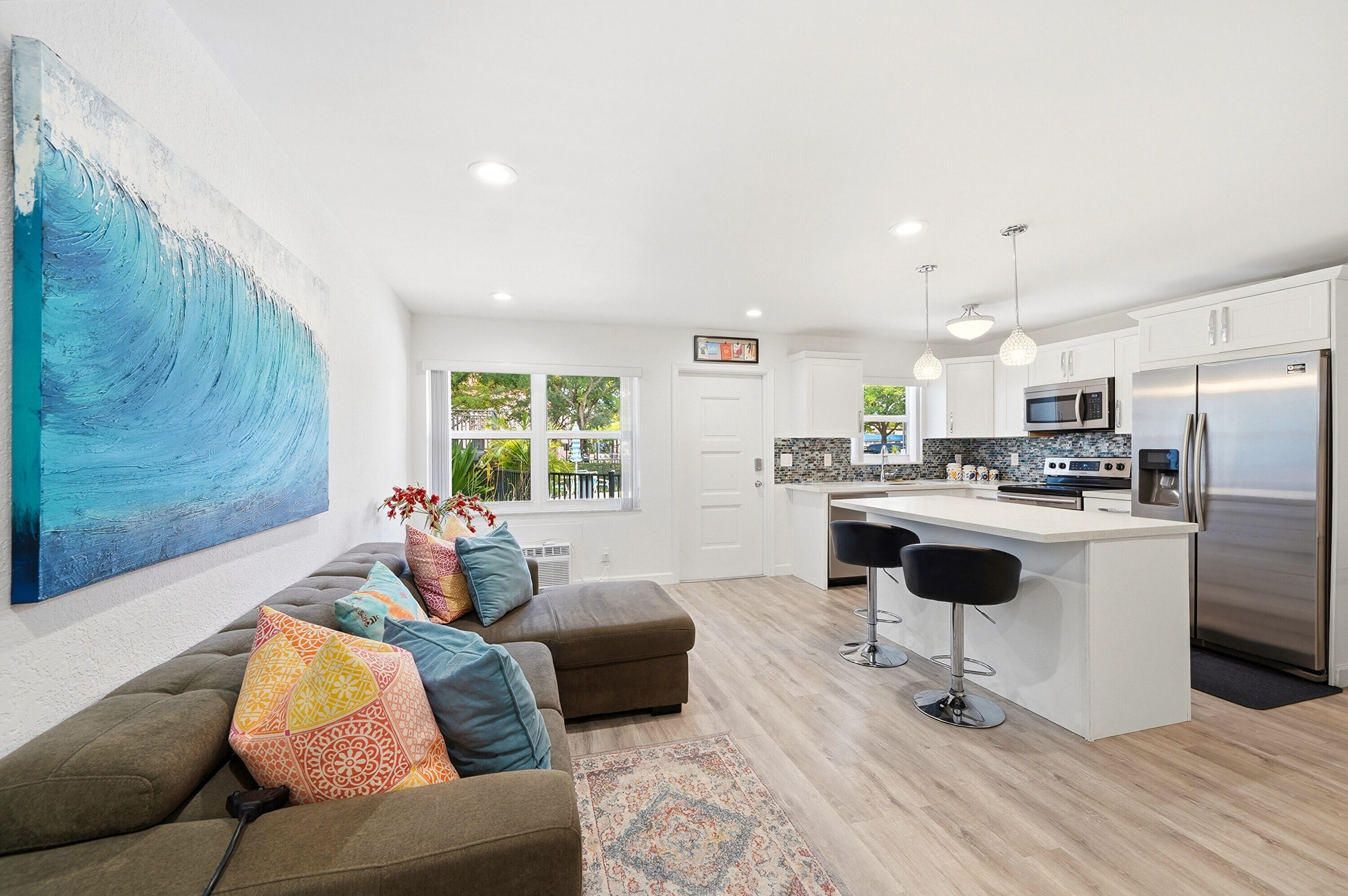 3510 Harrison Street, Unit 4 Hollywood, FL 33021 - Photo 6 of 31 a living room with stainless steel appliances kitchen island granite countertop furniture and a rug