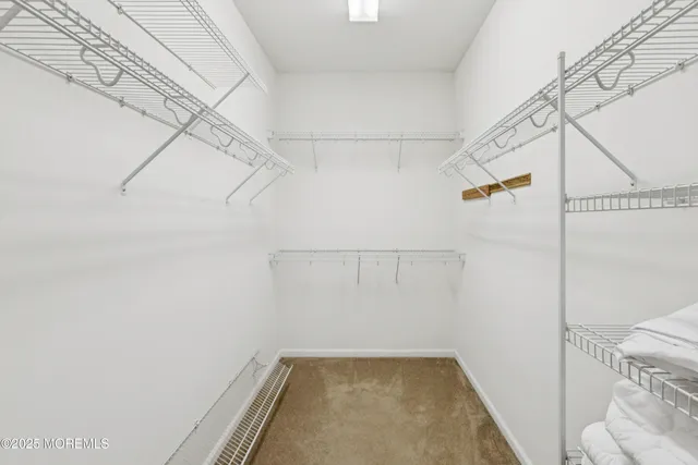 a living room with furniture and a ceiling fan