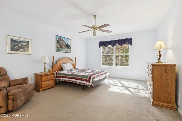 a dining room filled with lots of furniture and a chandelier