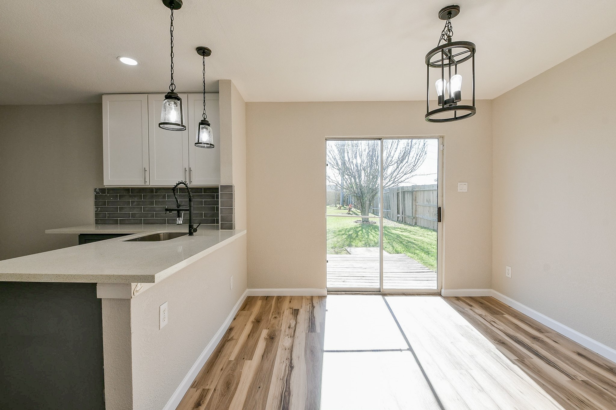20807 Lansing Ridge Lane Katy, TX 77449 - Photo 13 of 35 a room with a chandelier and a view of kitchen