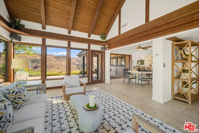 a view of a dining room and livingroom with furniture