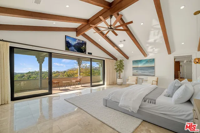 a view of a chairs and table in patio