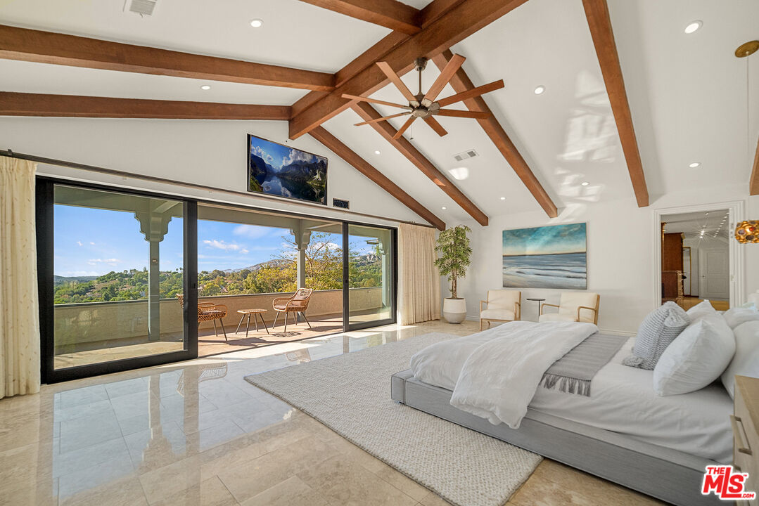 11875 Pradera Road Santa Rosa Valley, CA 93012 - Photo 18 of 35 a bedroom with furniture and large windows