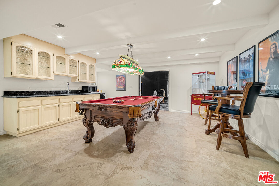 11875 Pradera Road Santa Rosa Valley, CA 93012 - Photo 26 of 35 a living room with furniture and a kitchen area